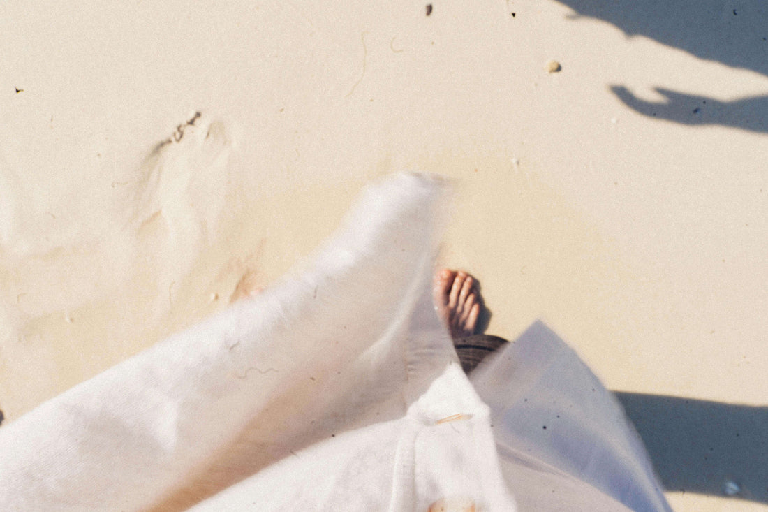 Grounding & Earthing: The Simple Science-Backed Habit That Could Transform Your Health - person walking barefoot on sand