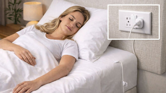 a woman sleeping on a grounding bedsheet plugged into a wall outlet