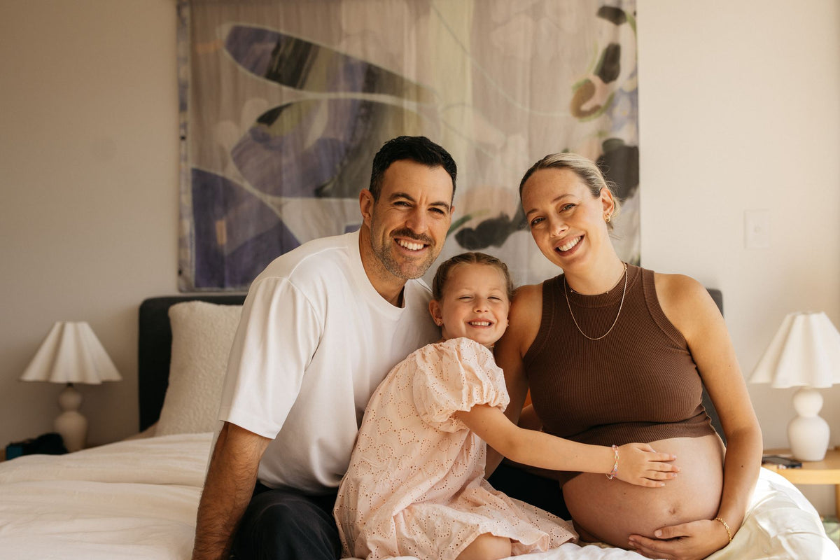 James McWhinney, founder of Premium Grounding, at home with his wife Alana and their daughter