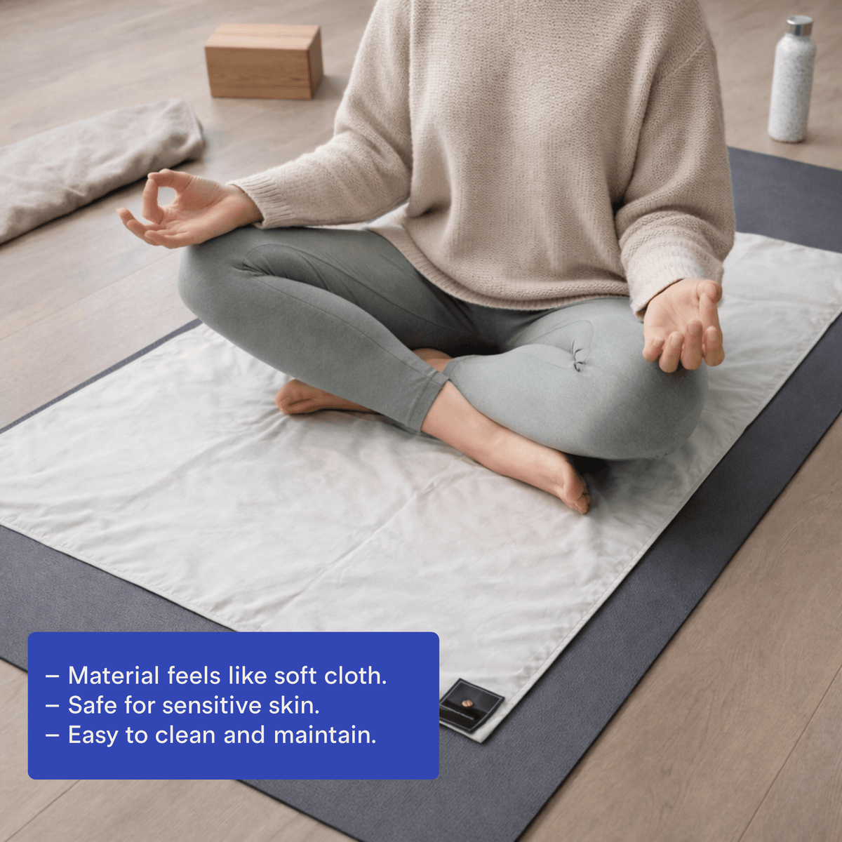 Grounding pad placed on an office chair seat for desk use